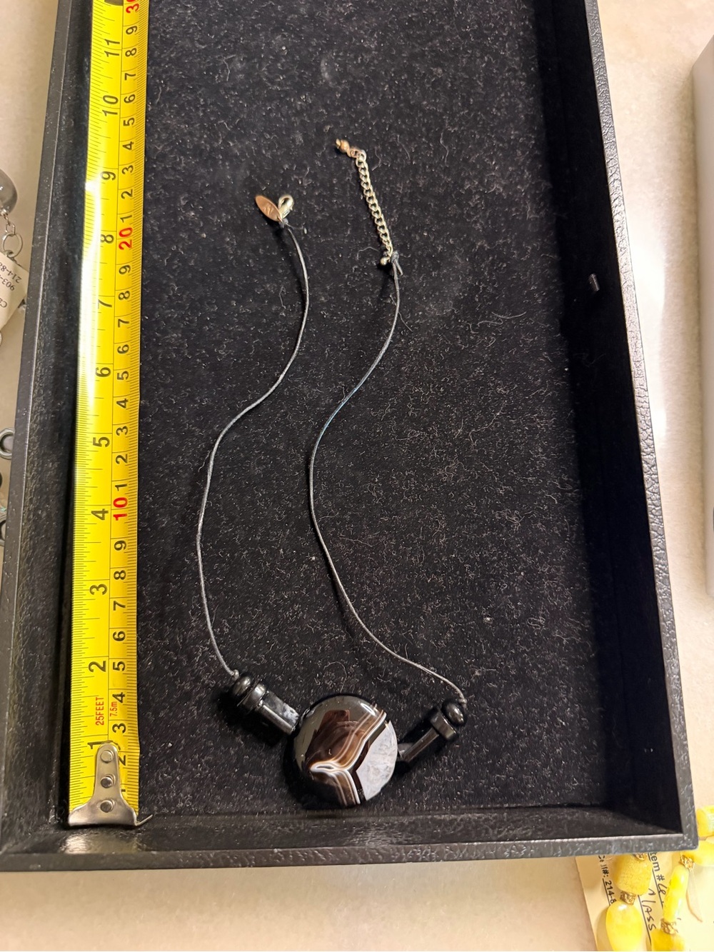Black necklace with large round stone